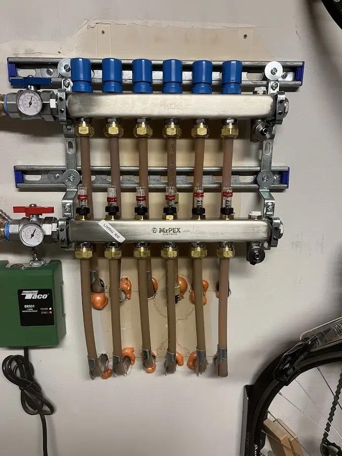 Plumber performing Water Heater Repair at a residential property in West Allis